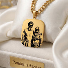 Load image into Gallery viewer, Gold pendant with engraved image on a white cushion, branded 'PendantsBazaar'.