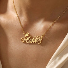 Load image into Gallery viewer, Gold necklace with 'Ashley' pendant on a person wearing a white garment.