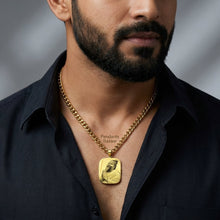 Charger l'image dans la galerie, Man wearing a black shirt with a gold necklace featuring a pendant.