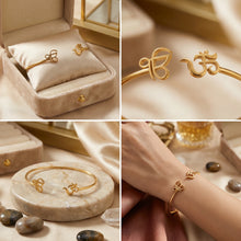 Charger l'image dans la galerie, Gold bracelet with intricate design in a jewelry box, on a stone surface, and on a wrist.
