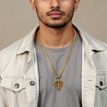 Charger l'image dans la galerie, Man wearing a gold chain with a symbol pendant on a beige background
